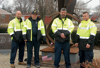 Highway department crew maintains veterans memorial